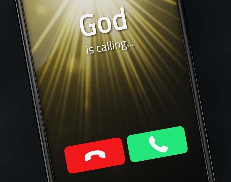 iPhone with God is Calling on the screen.